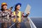 Female electrical engineers are discussing electricity generation from the solar panel