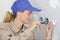 Female electrician fixing electric cables in socket