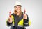 Female electrician holds up a measuring device