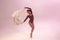 Female elegant ballerina dancing ballet with cloth