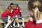 Female Elementary School Pupils Whispering In Playground