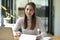 Female employee sits in her productive office desk