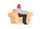 Female employee typing laptop while sitting on a single sofa