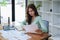 female employee using a calculator to calculate financial documents