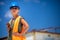 Female engineer architect with a safety helmet and a cell phone