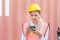 Female engineer in the hard hat uses mobile phone, Industrial worker using mobile smartphone in industry containers cargo