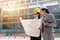 Female engineer staring at the building blueprint.