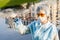 Female epidemiologist demonstrates a test tube with water from a city river