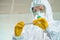 Female epidemiologist using medical sample test tube