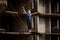 Female equilibrist balancing with arms raised on the slackline rope