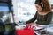 Female executive in headphones working at desk