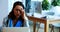 Female executive working over laptop in office