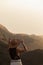 Female explorer with a mountain view during sunset