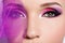 Female eye with beautiful fashion bright pink makeup