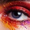 Female eye close-up with bright fashionable makeup. Creative makeup with bright saturated colors. The art of makeup