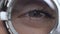 Female eye looking through optical trial frame closeup, vision correction, lens
