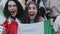 Female fan waving with italian flag during football match