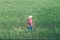 Female farmer agronomist posing in cultivated barley crop field