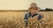 Female farmer check the quality of crop spikelets in golden cereal field. harvest control