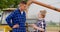 Female Farmer Discussing With Businessman On Farm