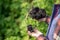 Female farmer hold soil in hands monitoring soil health on a farm