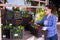 Female farmer loading truck with peppers in crates