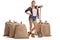 Female farmer posing with shovel and burlap sacks