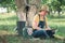 Female farmer using digital tablet in walnut orchard, innovative technology in organic farming