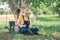 Female farmer using digital tablet in walnut orchard, innovative technology in organic farming