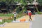 Female farmers working drying rice street, Lac village, Vietnam