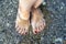 Female feet in clear sea water