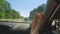 Female feet on the dashboard of the car, from the side of the passenger seat. the concept of summer holidays and travel