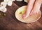 Female feet with drops of water, spa bowls, towels, flowers and candles.