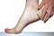 Female feet heel stone pumice on white background isolation, lifestyle body hygiene
