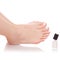 Female feet legs nail polish white in hands beauty