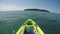 Female feet relaxing on kayak in pacific ocean point of view pov, inspirational landscape, active adventure travel