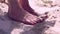 Female feet on a sand
