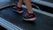 Female feet walking on treadmill. Woman completes workout routine, reaches goal