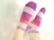 Female feets in colorful striped socks with vintage retro filter color