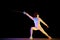 Female fencer, athlete in full uniform training, competing, practicing over black background in neon light