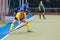 Female field hockey player performing penalty shot