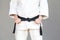 Female fighter torso poses in white kimono and sportive strong a