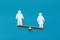 Female figure outweigh male on seesaw, blue background
