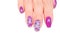 Female fingers with painted nails. lilac nails with a pattern