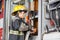 Female Firefighter Fixing Water Hose In Truck