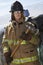 Female Firefighter Holding Axe