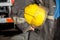 Female Firefighter Holding Yellow Helmet