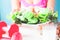 Female fitness holding salad dish and dumbbells on table, Healthy lifestyle concept