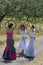 Female flamenco dancers in colorful dresses