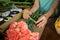 Female florist preparing bunch of flower in flower shop